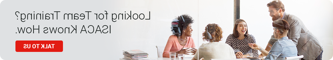 A group of people gathered around a desk in an office